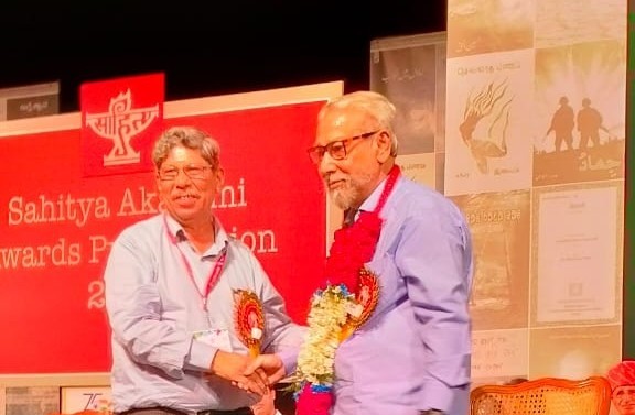 Hussain Ul Haque posing with fellow writers